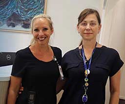 Two friendly nurses stand at the reception area of the Buderim Private Hospital Pre-Admission Clinic.